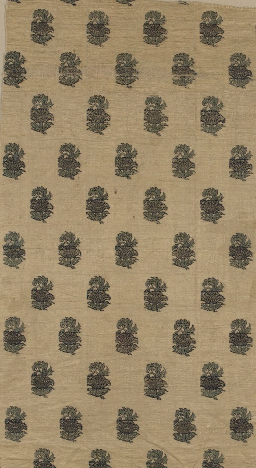 Warm ivory silk scattered with upright rows of woven dark floral butis