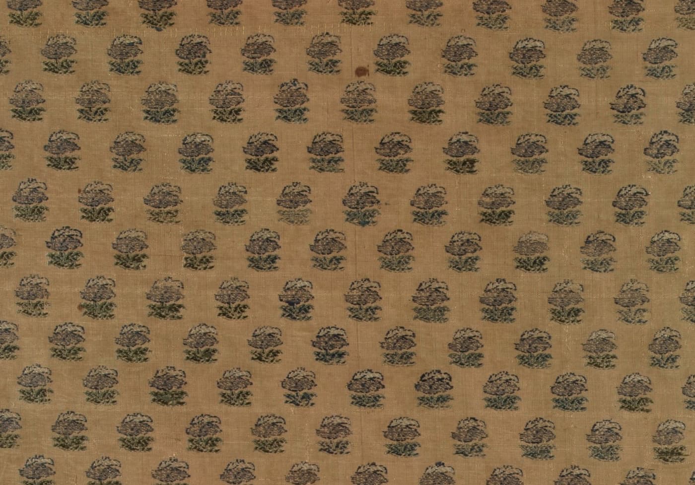 Golden-tan silk with an allover grid of small woven flower butis
